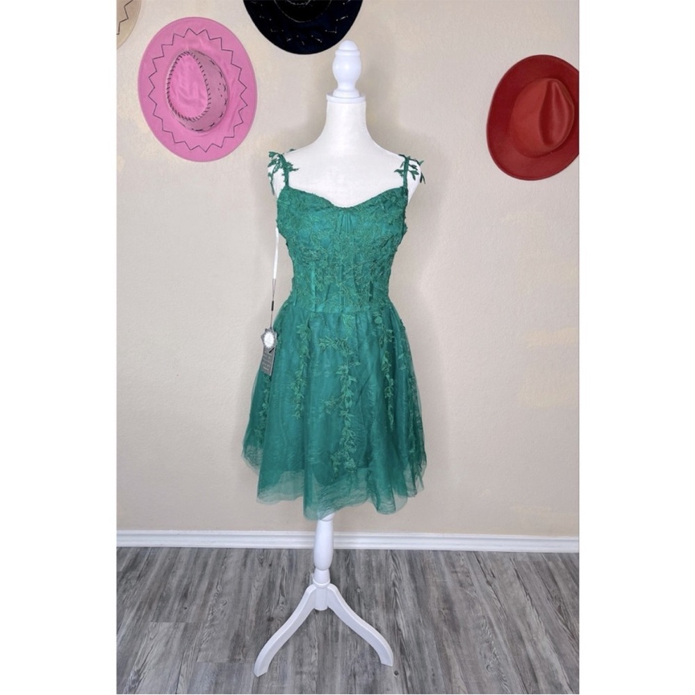 Women’s short green lace dress with spaghetti straps